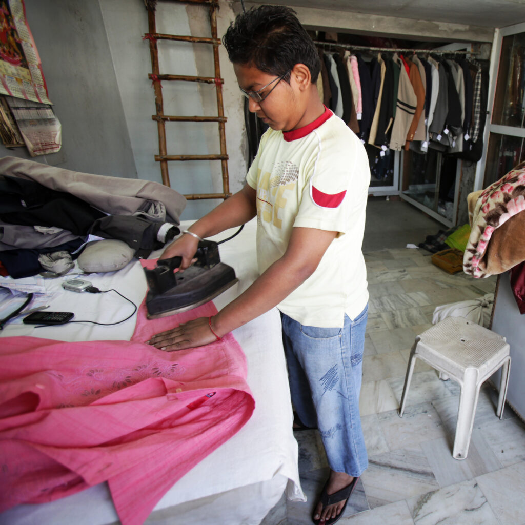 Child ironing clothes