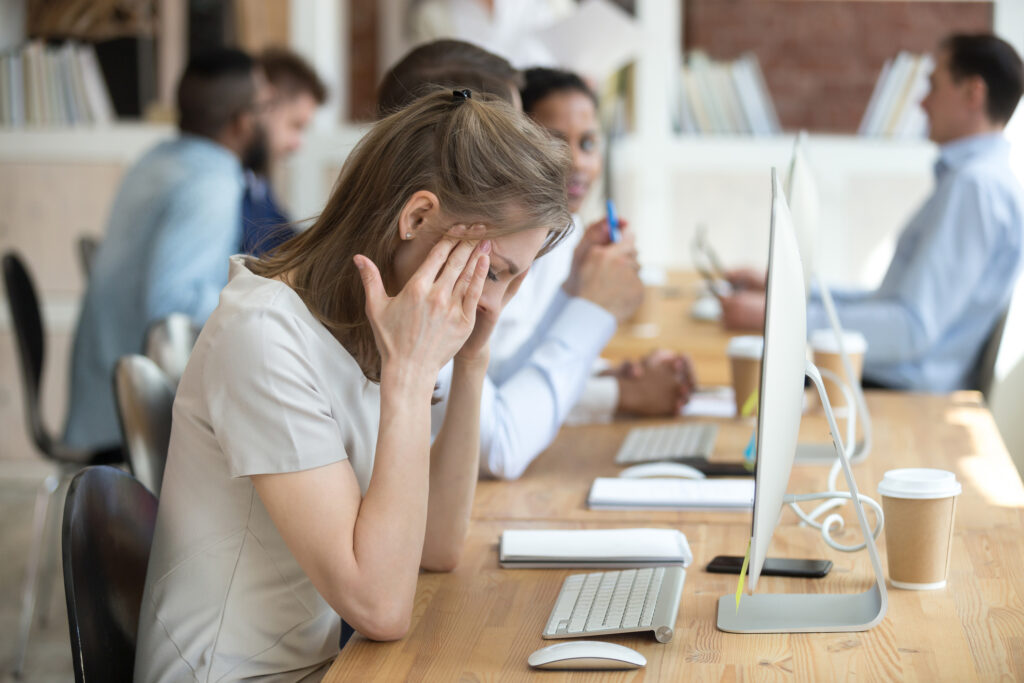 Distressed woman at desk